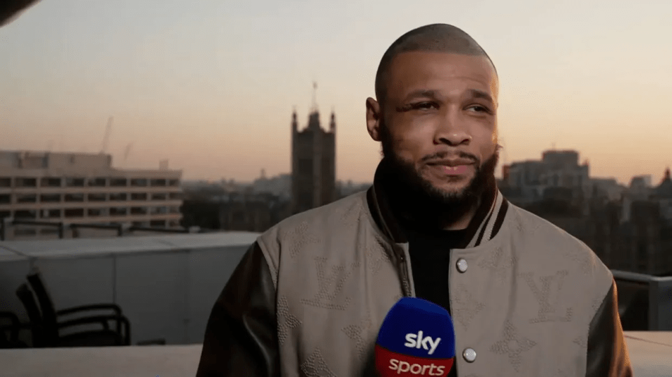 Man in a tan jacket being interviewed by Sky Sports.