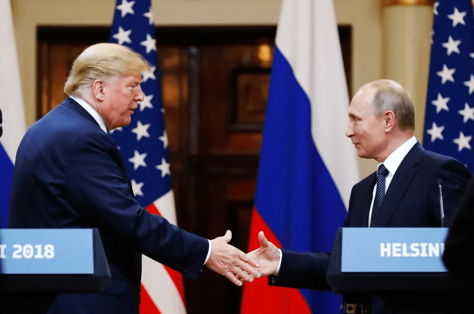Trump and Putin shaking hands in Helsinki.