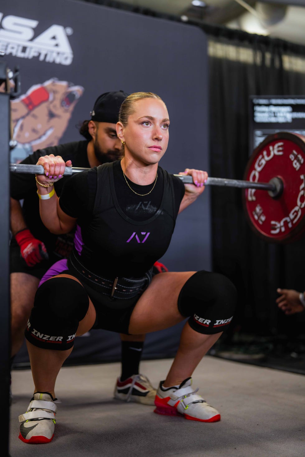 hailey squatting at a powerlifting meet in 2023.