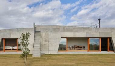 concrete isumi villa by takeshi hosaka architects spreads over land in japan
