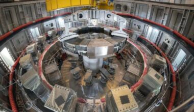 Installation of the first superconducting magnet, Poloidal Field Coil #6.