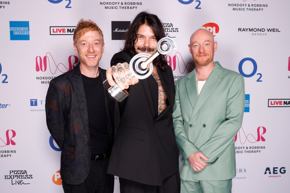 Biffy Clyro accepting the Best Live Act award.