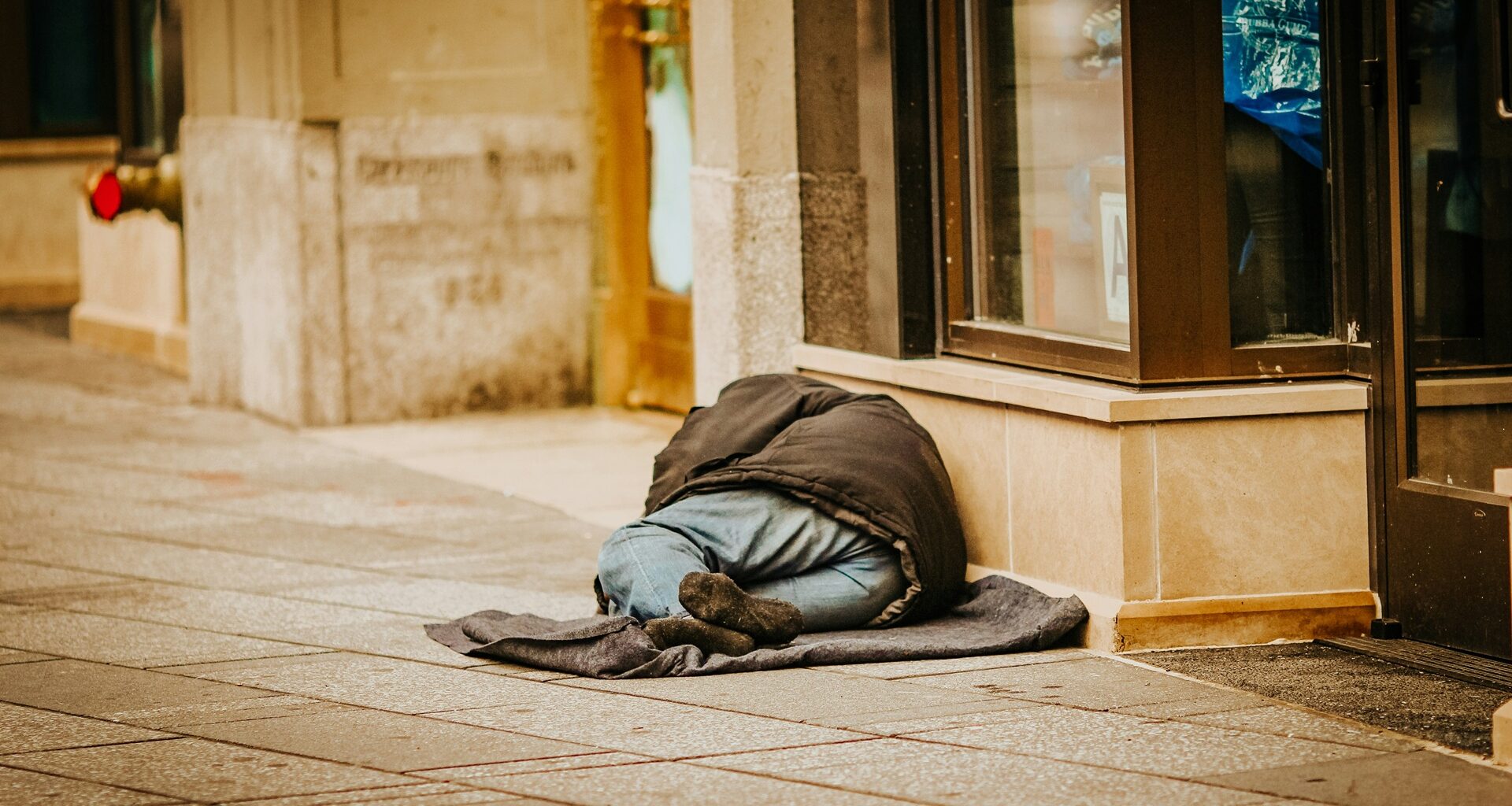 a person experiencing homelessness on the street
