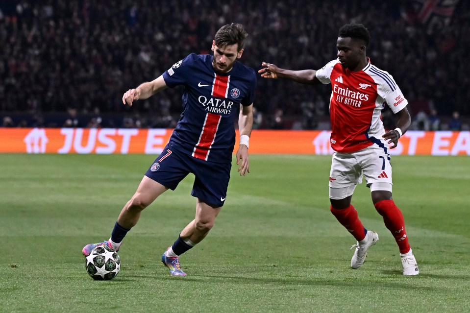 Soccer players competing for the ball.