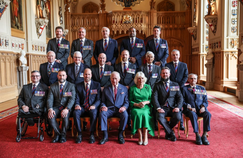 Group photo of King Charles III, Camilla, Queen Consort, Prince William, and members of the Victoria Cross and George Cross Association at Windsor Castle.
