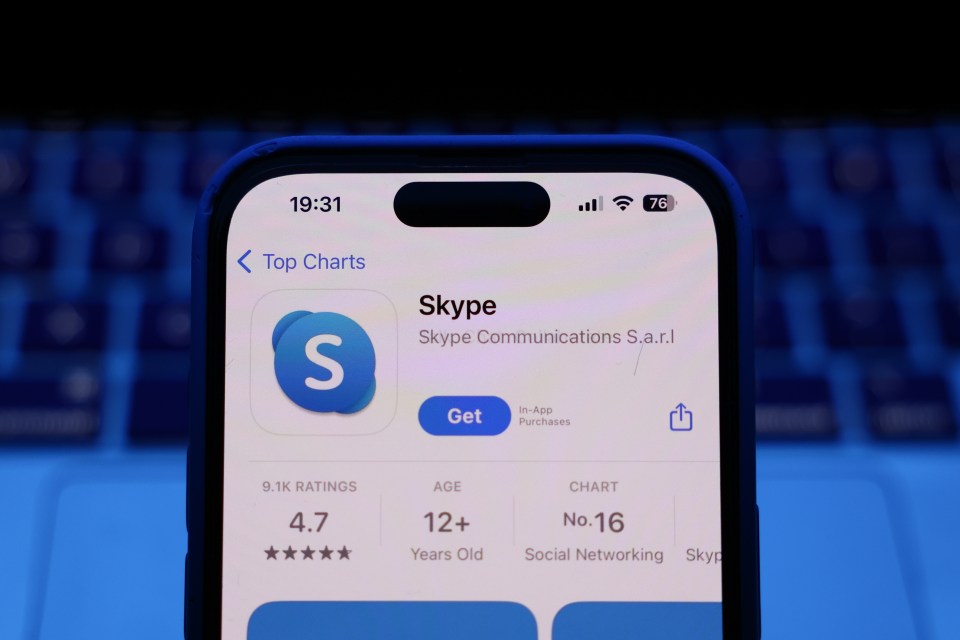 Illustration of a phone displaying the Skype app store page.