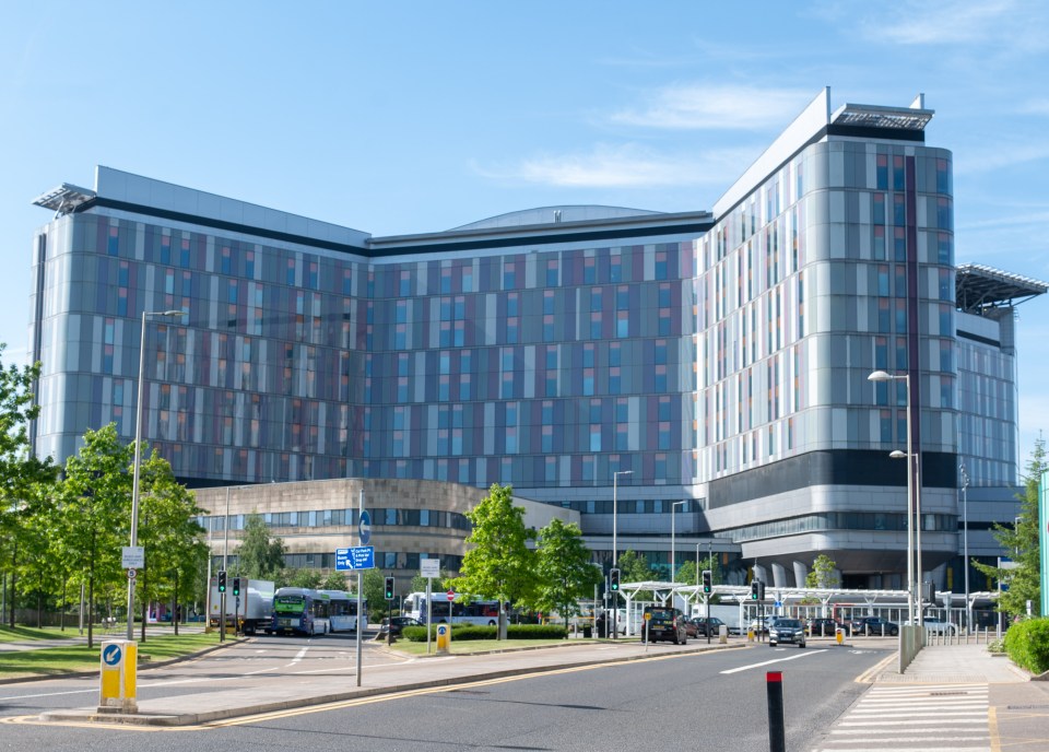 Exterior view of a large modern hospital.