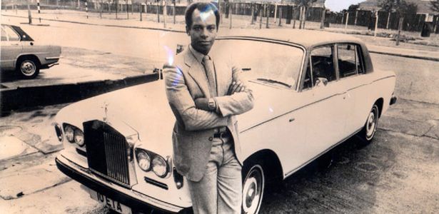 Michael Showers pictured with his white Rolls-Royce