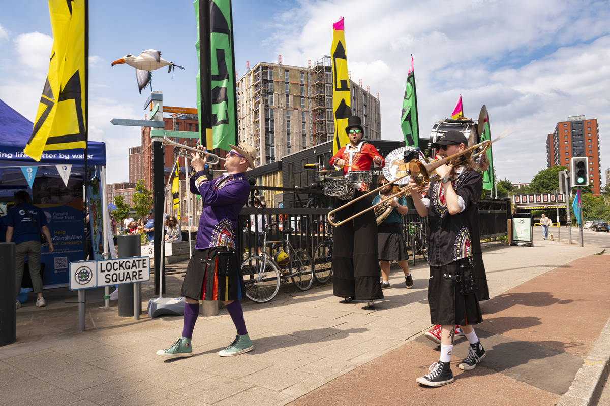 brass band on side of canal in salford