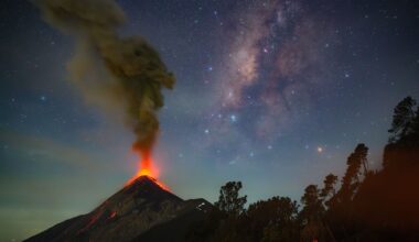 a volcano erupts beneath the milky way