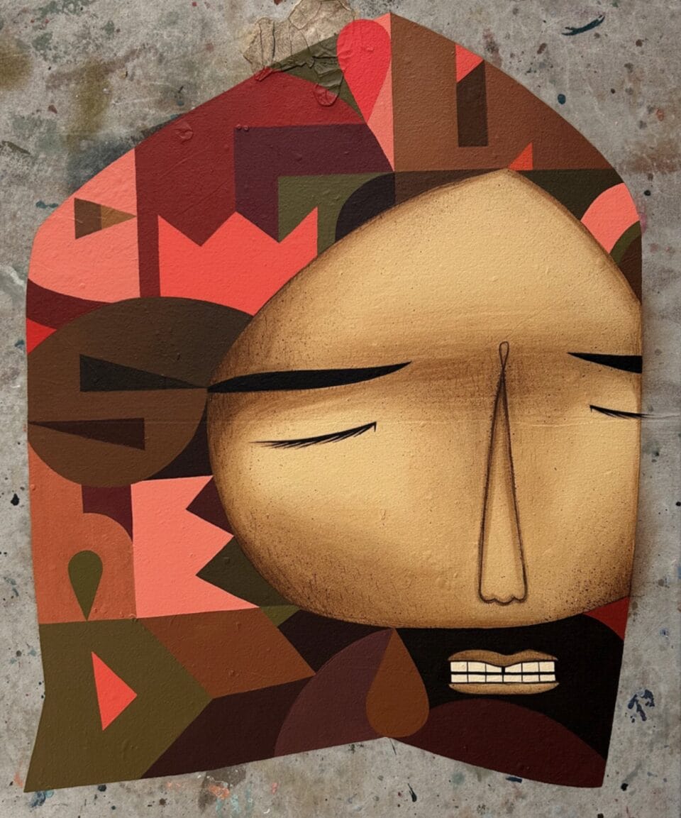 a wooden artwork featuring a man with a beard, with his eyes closed, with a red, pink, and brown geometric pattern on his hair or hood