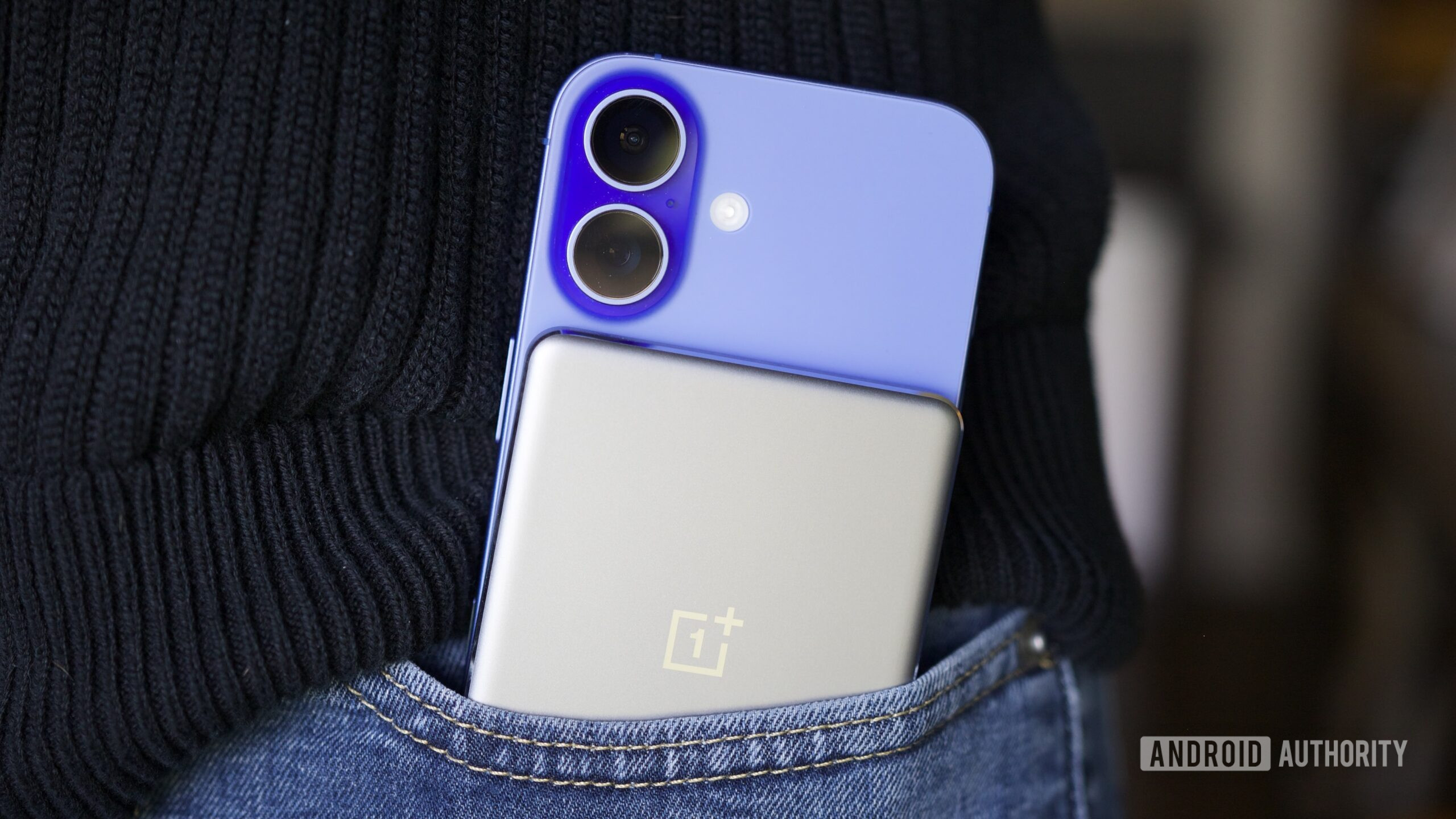 The OnePlus Slim Magnetic Power Bank on an iPhone 16.