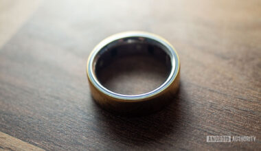 An Oura Ring 4 rests on a wooden surface
