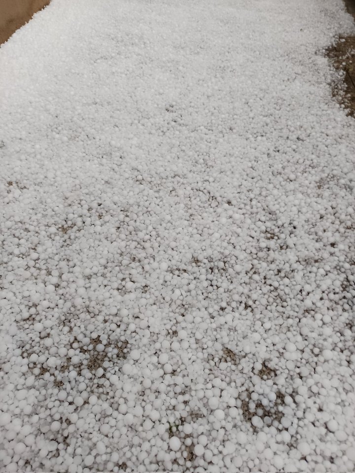 Hailstones covering the ground.
