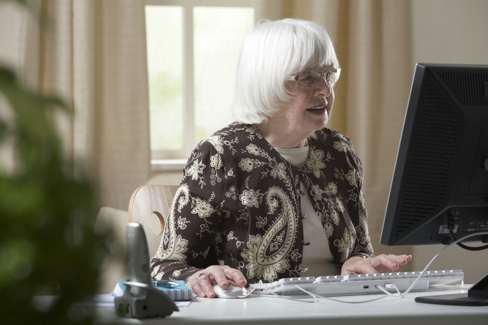 Person in retirement looks at computer
