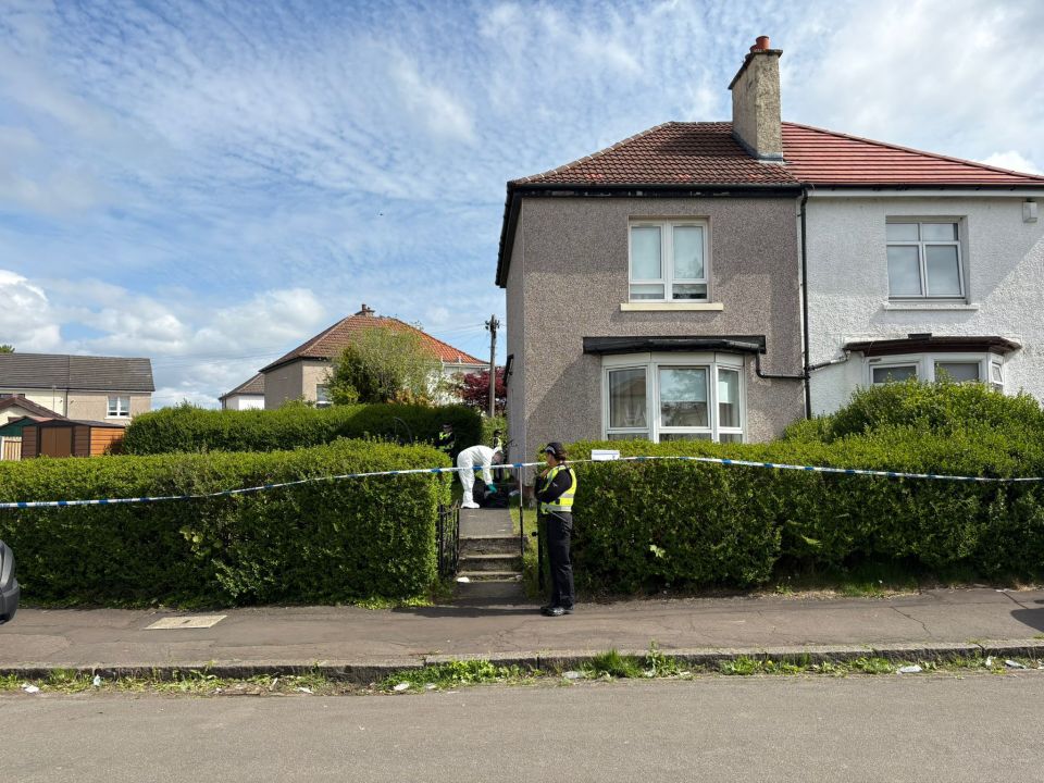 Police and forensics at a house on Caldwell Avenue.