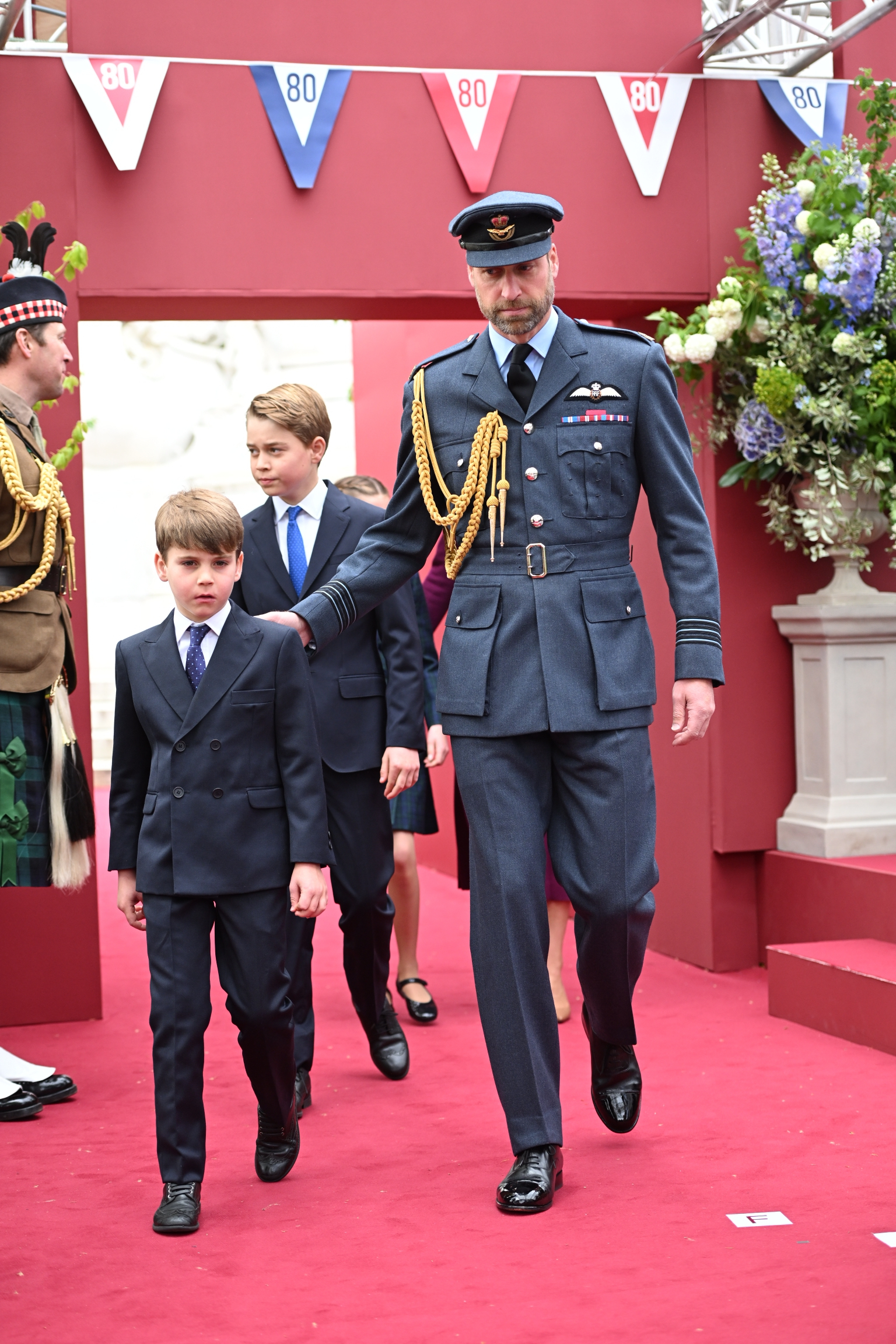 Prince Louis, Prince George and the Prince of Wales arrive ahead of the military procession.