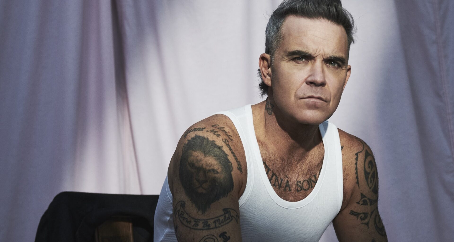Robbie Williams announces new album 'BRITPOP', shares blistering single with Black Sabbath's Tony Iommi