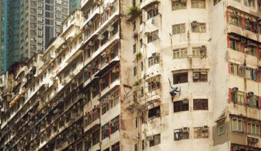 a detail image of a person hanging from the side of a building
