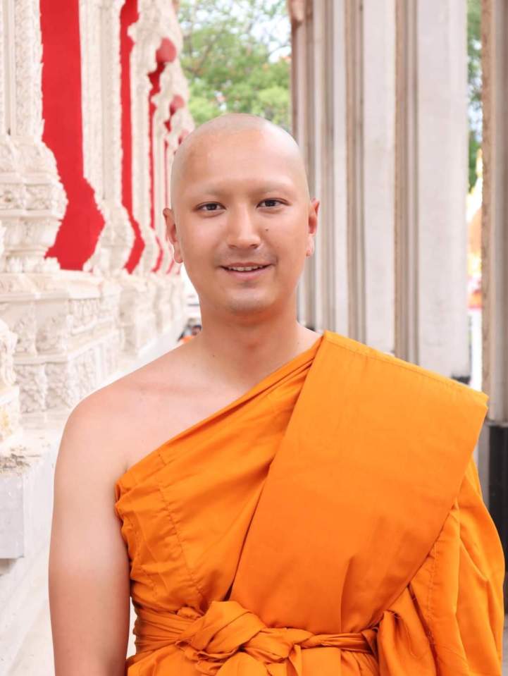 A Buddhist monk in orange robes.