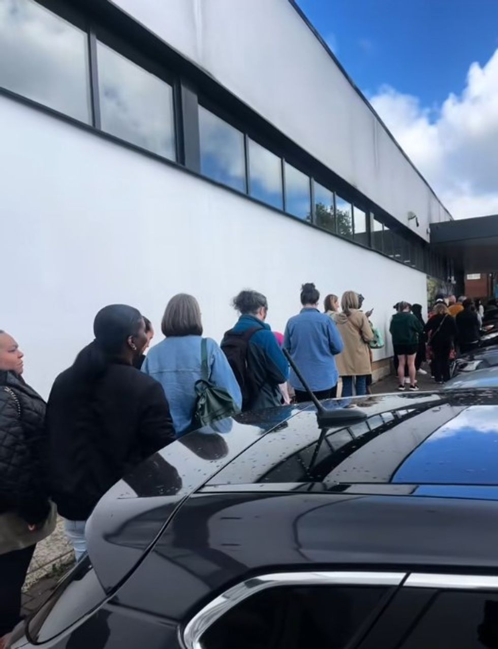 Shoppers queueing outside of Aldi