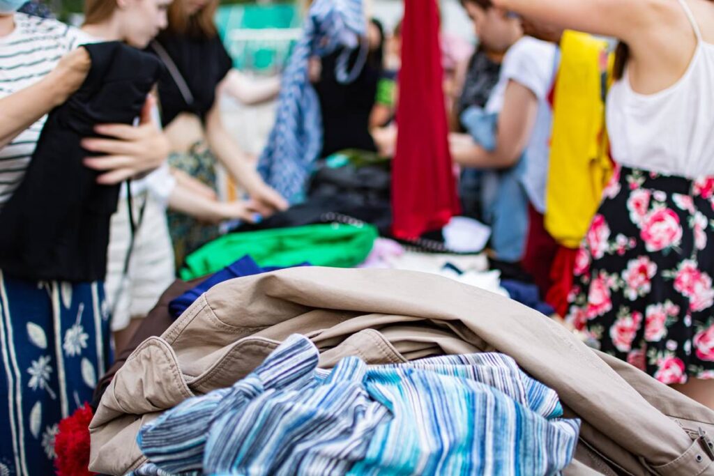 a pile of clothes at a jumble sale