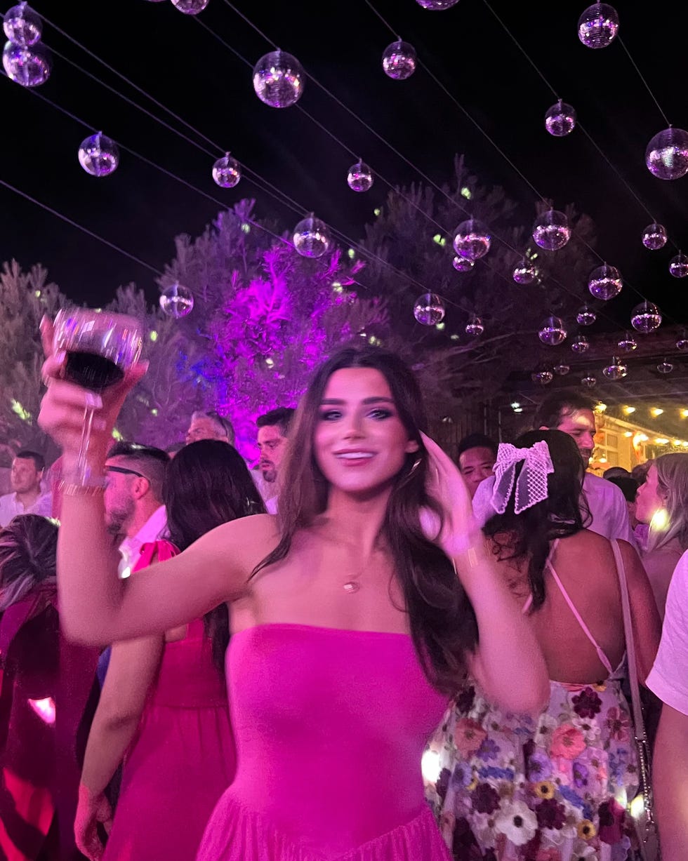 a person in a pink dress