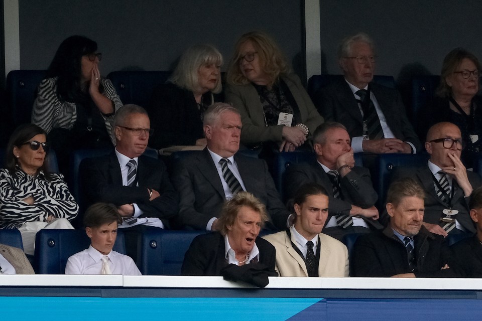 Sir Rod Stewart yawning during extra time at a sporting event.