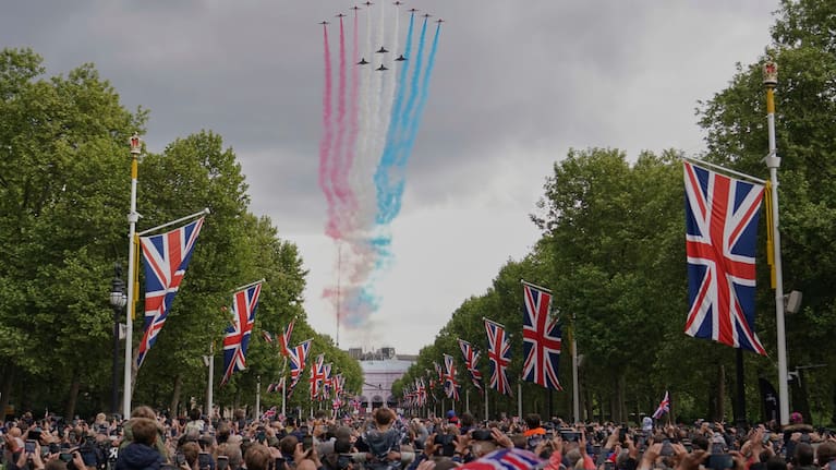 The Red Arrows the Royal Airforce display team, fly over the Mall and Buckingham Palace during the V-E Day 80th anniversary parade in London