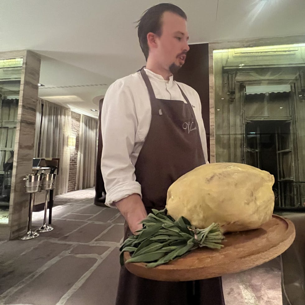 a man holding a large potato