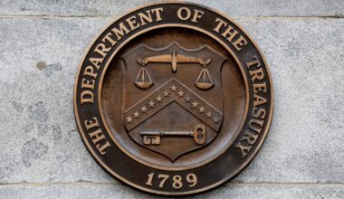 Seal of the U.S. Treasury logo on the wall of the Treasury building in DC