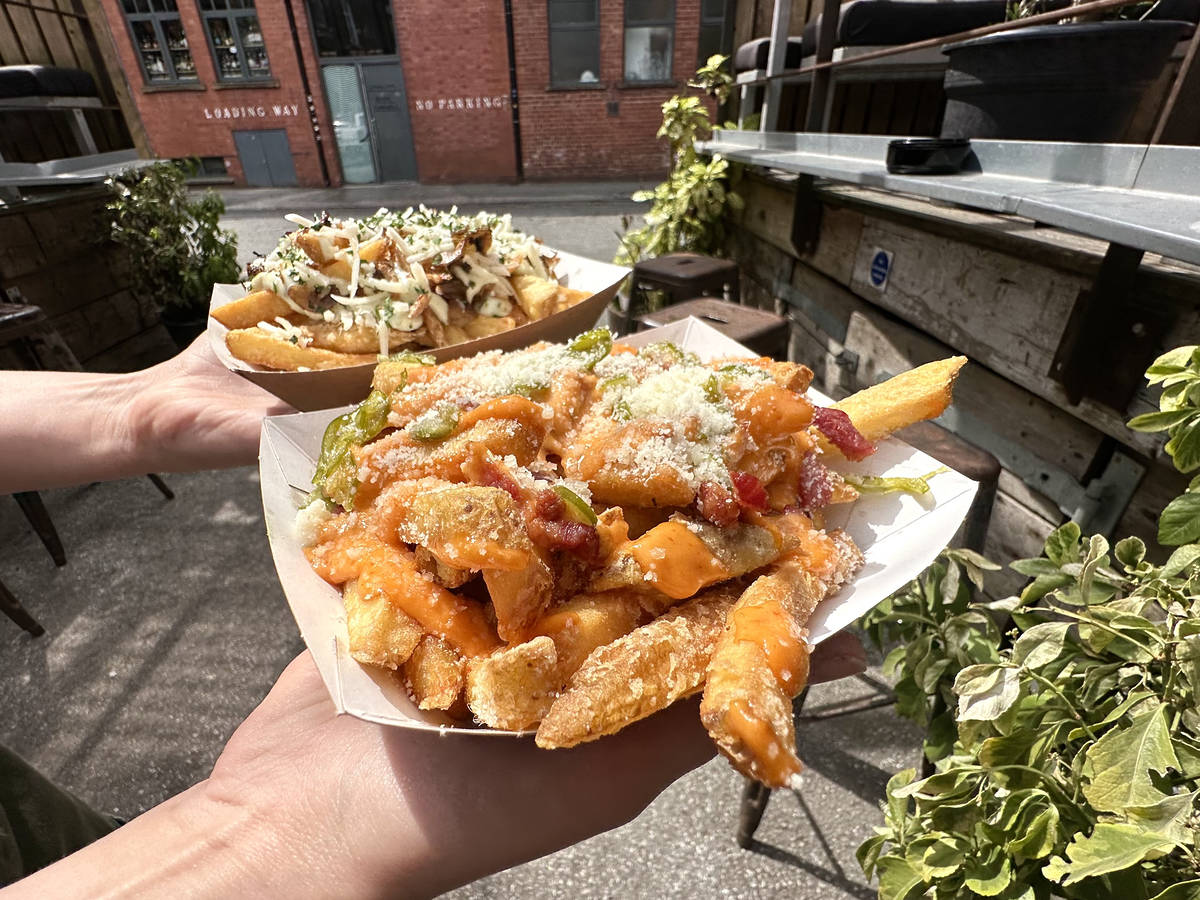two loaded chippy trays in yes garden in manchester