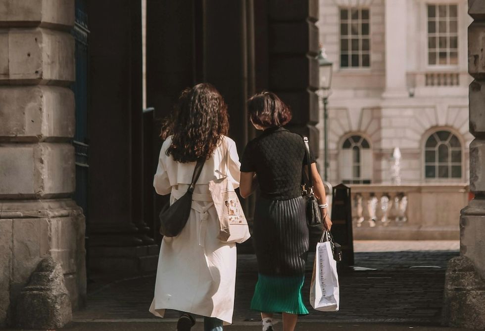 two women walking around london