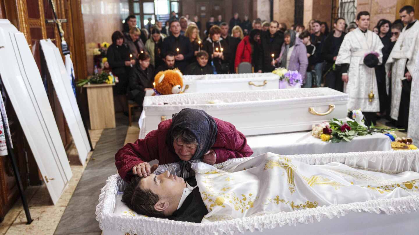 Photos of Three Ukrainian Siblings Buried in Aftermath of Russian Missile Strike