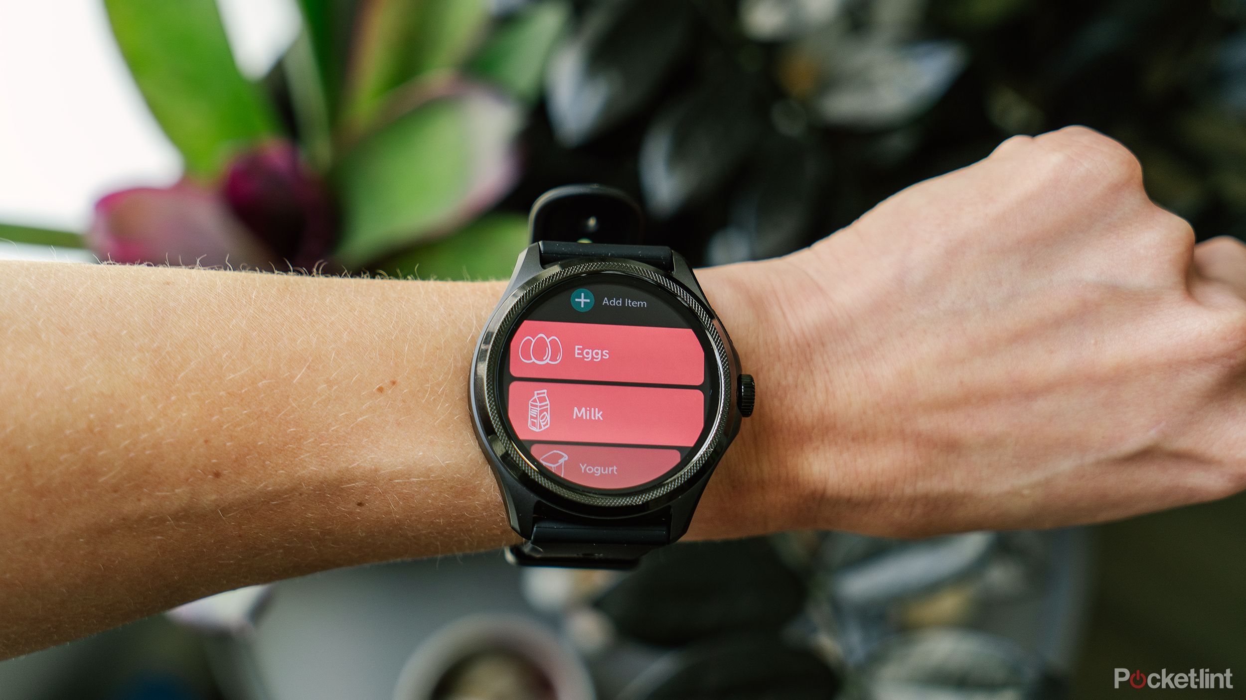 A person wears a Wear OS watch on their wrist