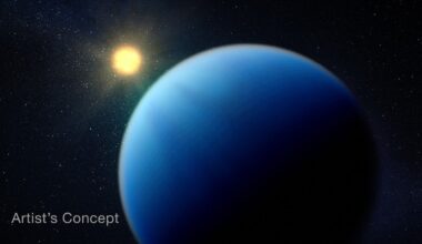Illustration showing a large fuzzy blue planet in the foreground, and an orange-yellow star in the background. The side of the planet facing the star is lit, and the side facing away is dark. The boundary between the lit and dark sides is fuzzy. The atmosphere is almost homogeneous in color and texture, with extremely subtle variations and no sign of a surface. The star is slightly more orange than the Sun. The black background of space is scattered with white points of light.