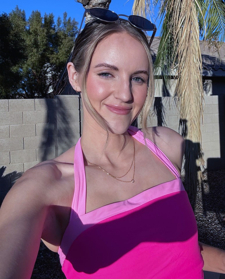 Woman in pink halter top.