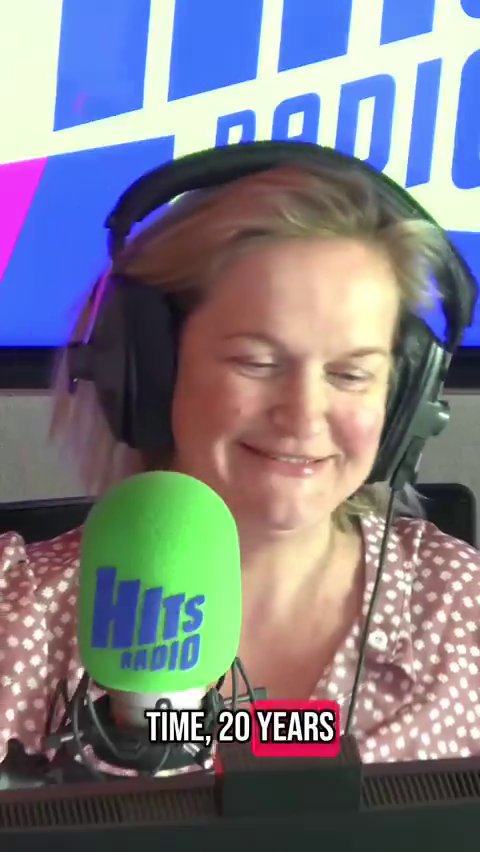 Woman smiling at Hits Radio microphone, text overlay: "Time, 20 years"