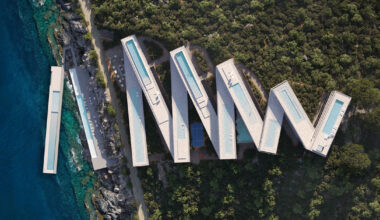 zig-zag resort extends linear terraces and pools along albania’s rugged coastline