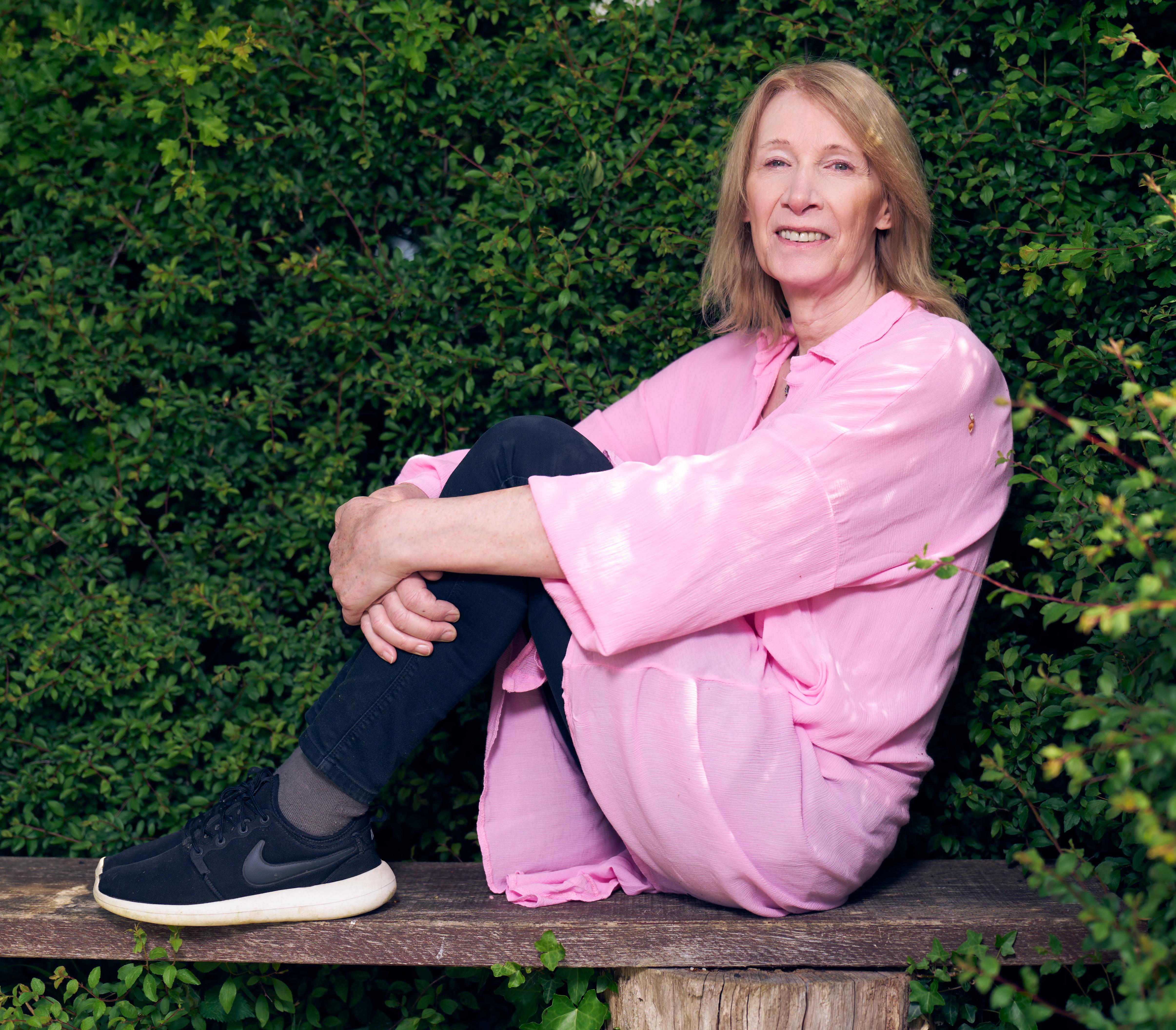 Portrait of Philippa York sitting on a bench.