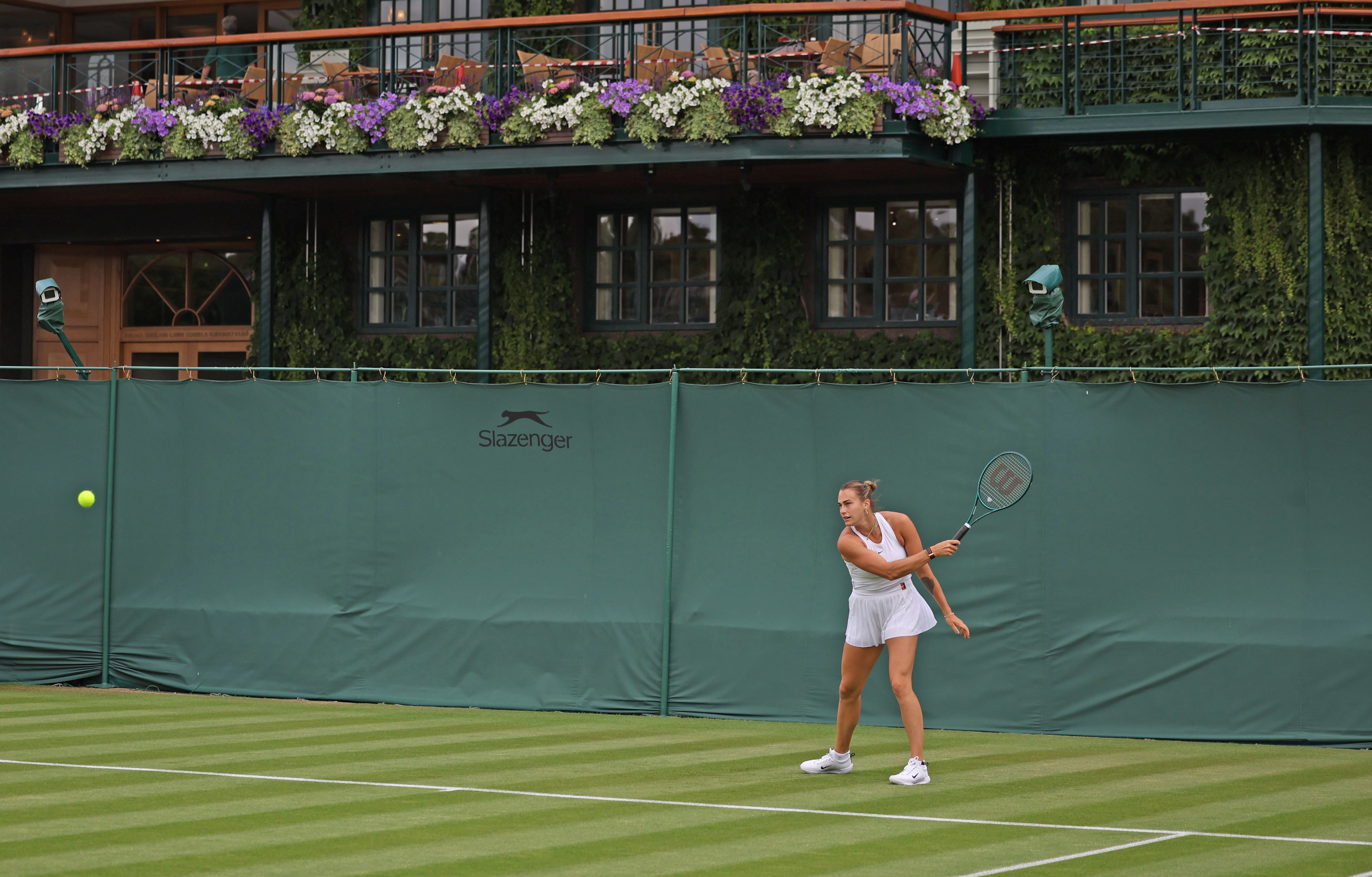 Aryna Sabalenka playing tennis.