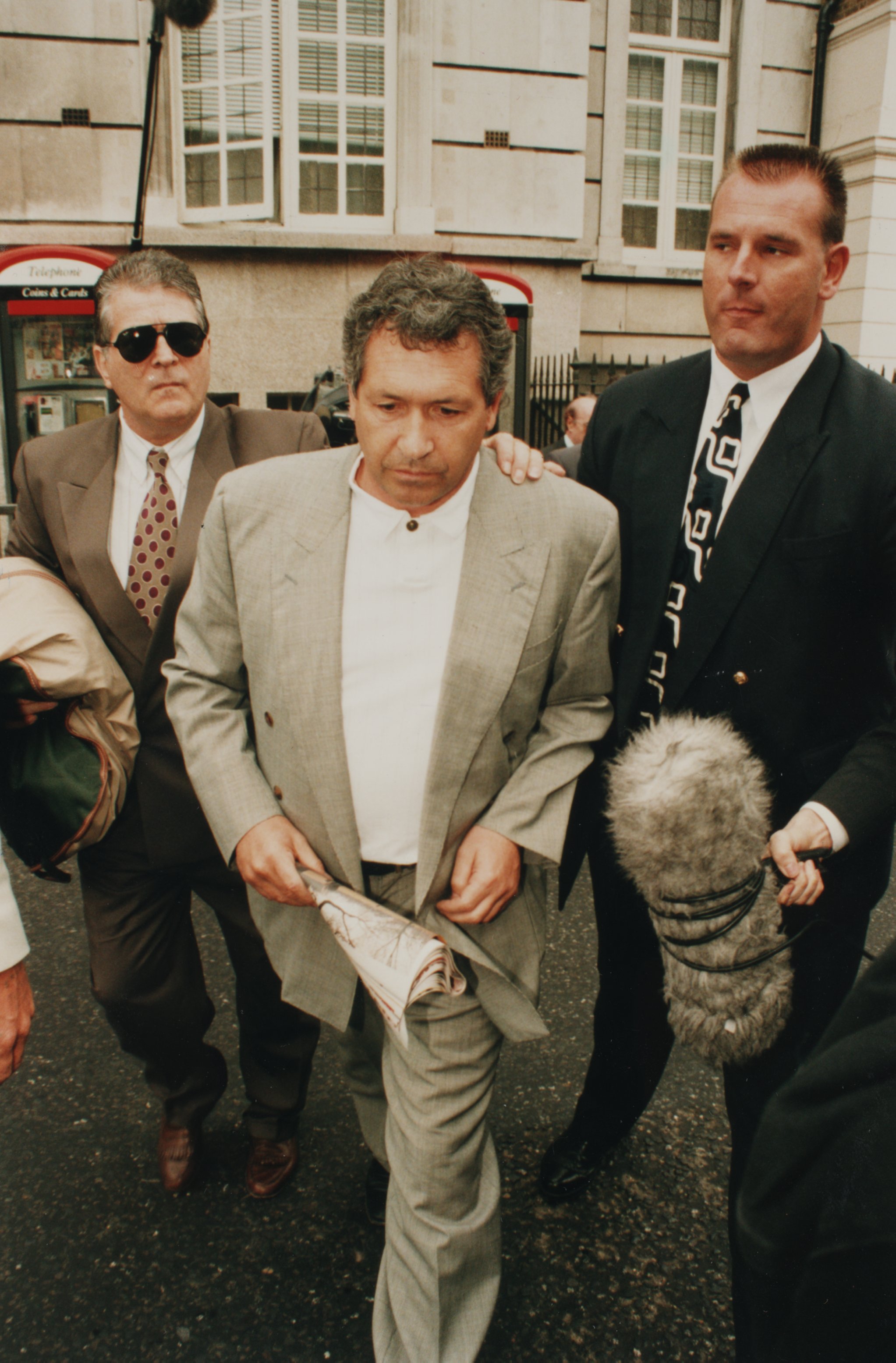 John Palmer leaving court after being arrested on fraud charges.