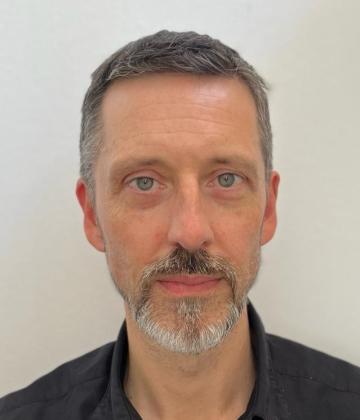 Headshot of Alex Cobham.