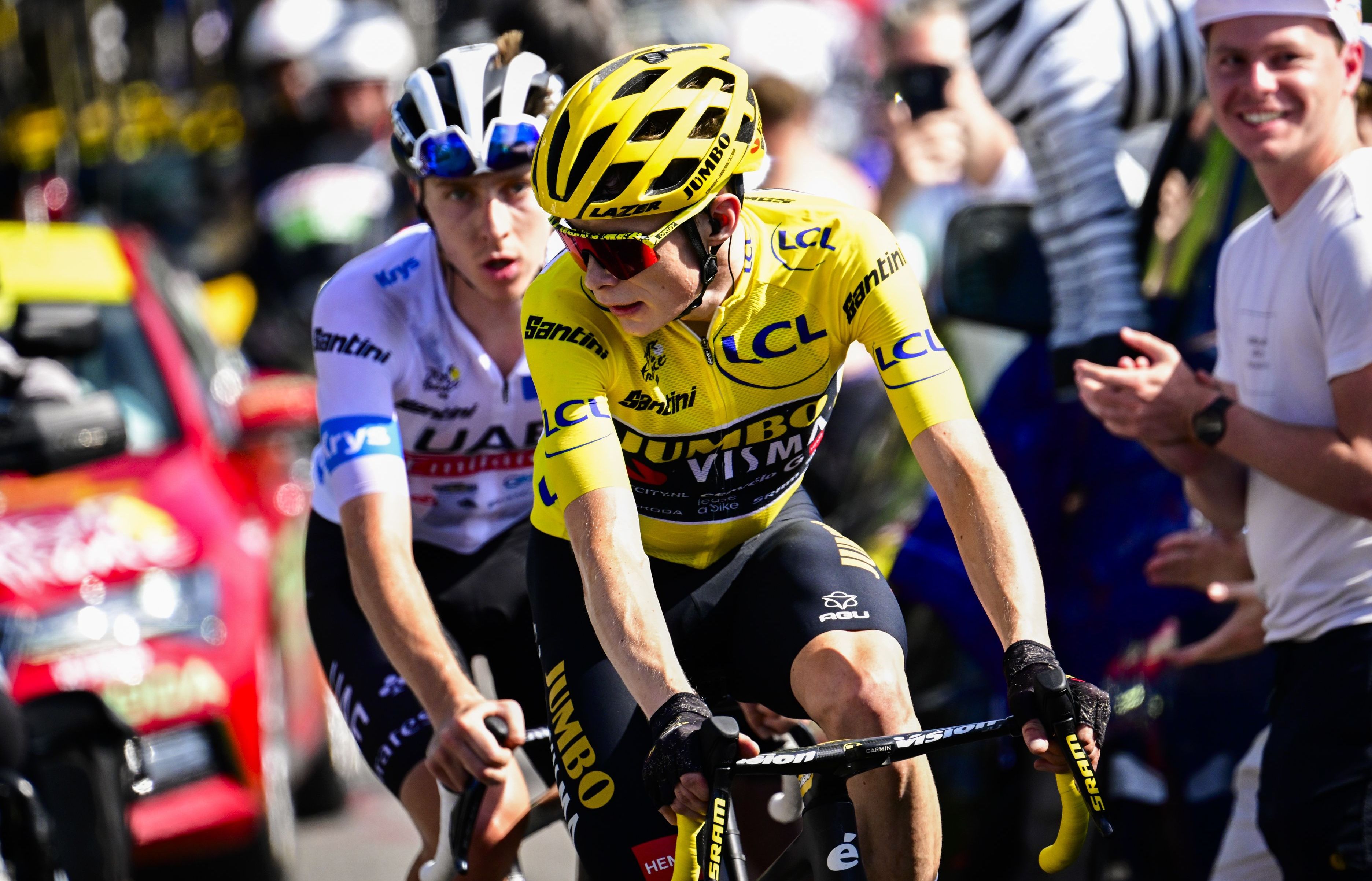 Jonas Vingegaard and Tadej Pogacar cycling in the Tour de France.