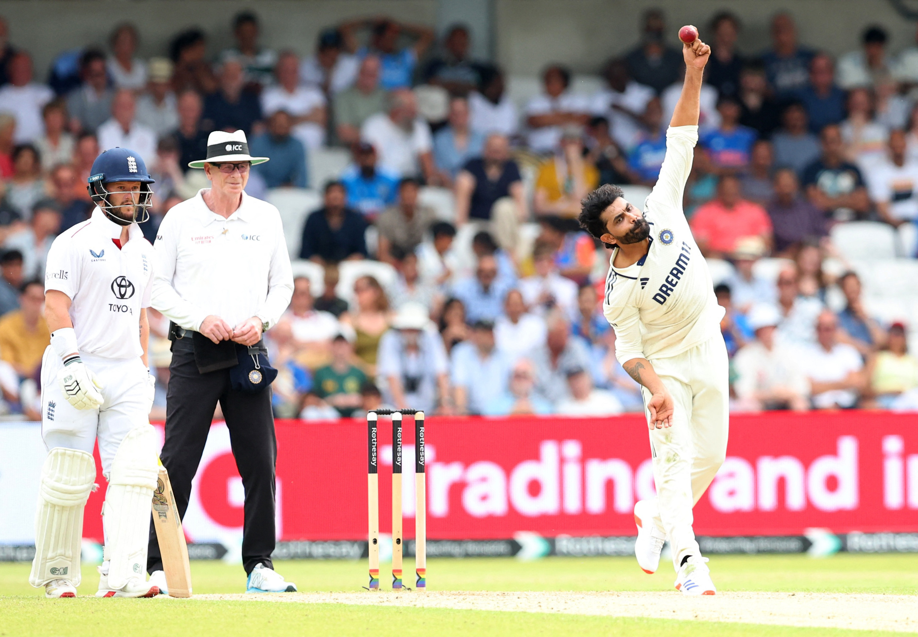 Ravindra Jadeja bowling during an England vs. India cricket match.