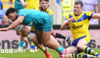 Taane Milne scores a try for Huddersfield Giants