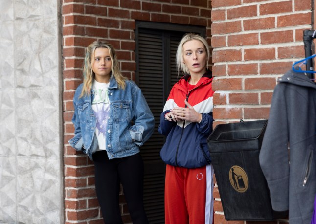 Lauren and Betsy hiding in the opening to the ginnel in the precinct in Corrie