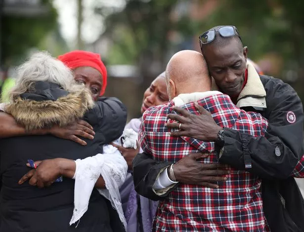 Ibrahima's father Mamadou at the scene with family