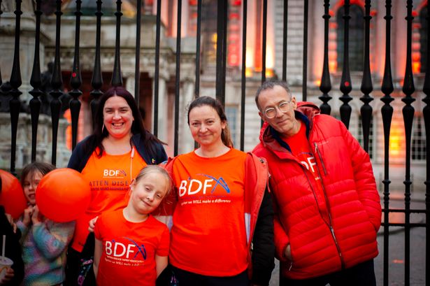 The Wolotkas with carer Orla Doherty (left), who is taking on a charity challenge to raise awareness, at Belfast City Hall on world Batten Disease awareness day June 9