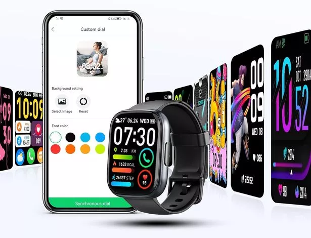 The black smart watch next to a phone